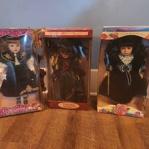3 Porcelain dolls with box damage